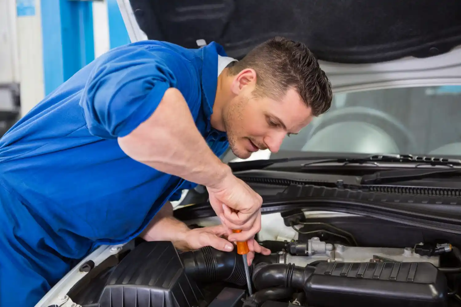 Expert technician repairing car AC compressor to restore cooling efficiency