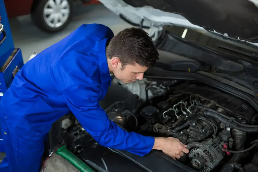 Professional technician performing car AC repair service in Duluth MN